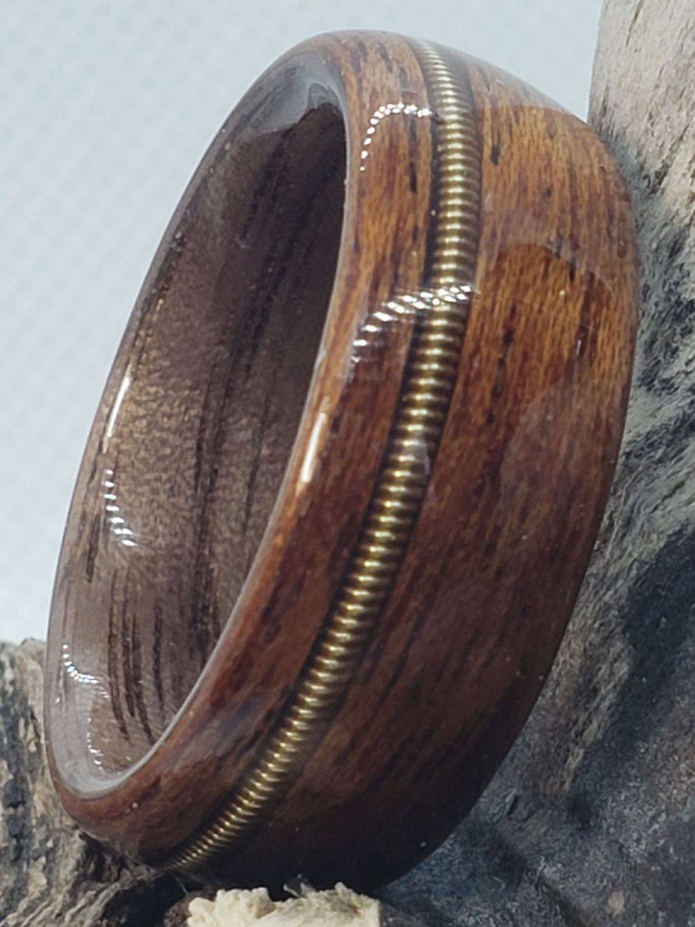 Sapele on Walnut with a Brass Guitar String Inlay