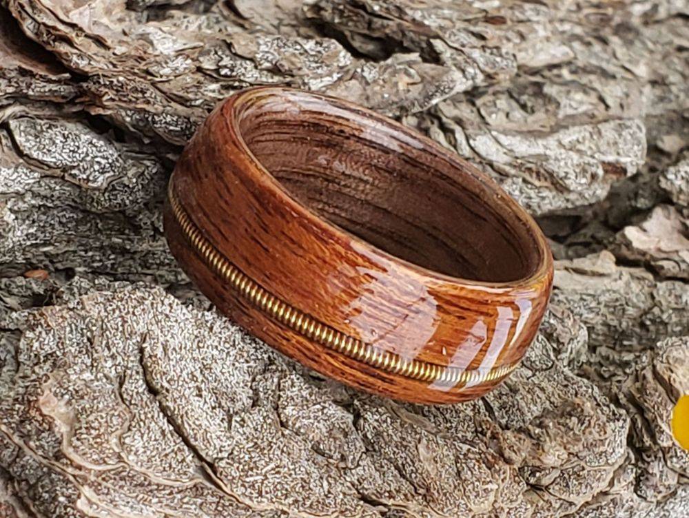 Sapele on Walnut with a Brass Guitar String Inlay